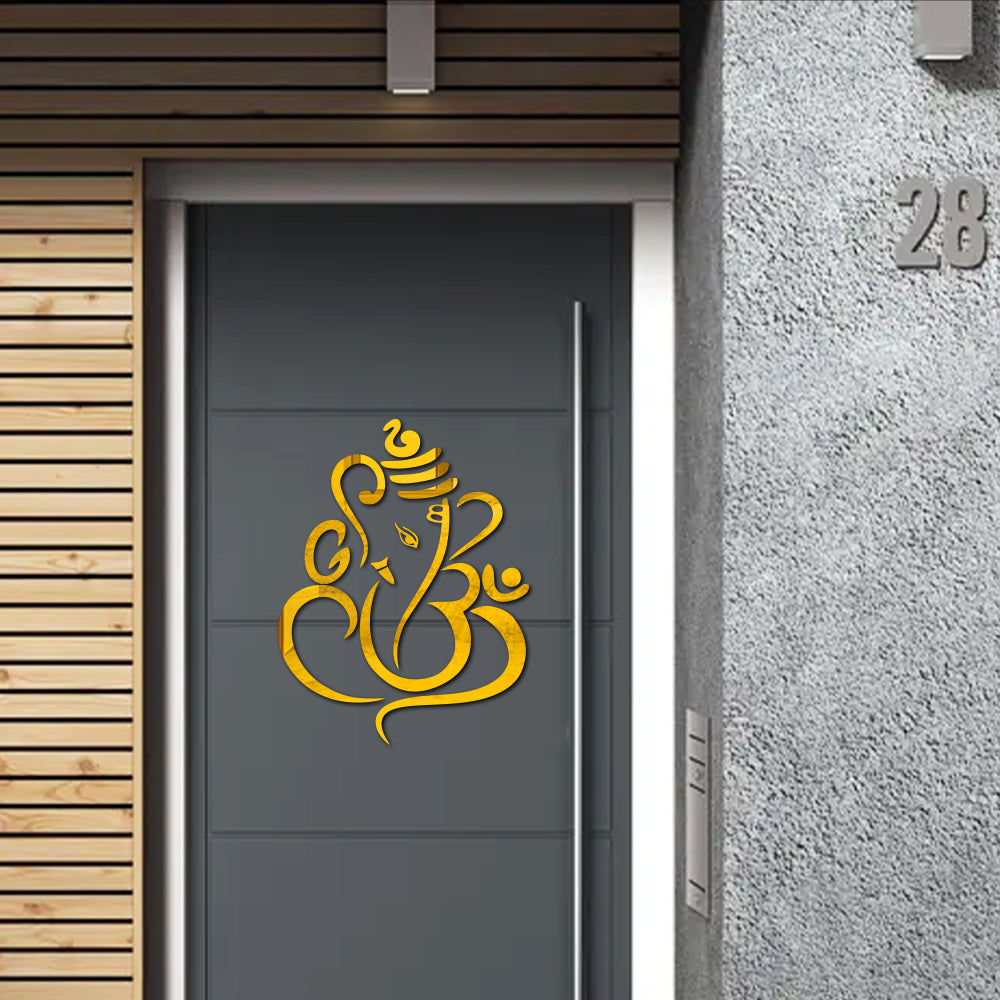 3D Metal Golden SS Lord  Ganesha Wall Decor for Building Facade 24 X 24 Inches Decorative yellow symbol on a gray door.