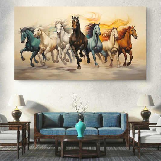 Canvas print of running horses in various colors on a wall above a blue sofa.