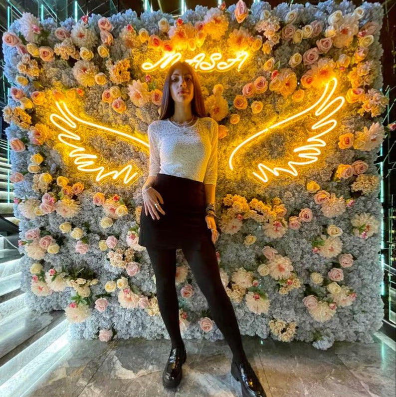 Angel Wings Neon Light for Wall Decors | Big Large Size Angel Wings Neon Light for Selfie Point | Custom Neon Sign (24 by 48 inches) Person posing in front of a floral wall with neon NASA sign and butterfly wings.