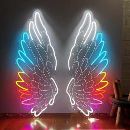 Angel Wings Neon Light for Wall Decors | Big Large Size Angel Wings Neon Light for Selfie Point | Custom Neon Sign (48 by 48 inches) Neon light sculpture of angel wings in a room with a wooden floor and brick wall.