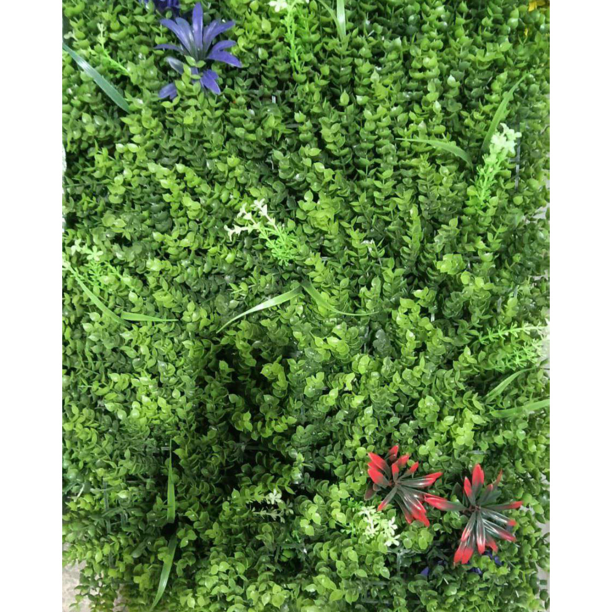 Artificial Vertical Garden, Artificial Wall Flower for Wall Decor | Artificial Green Wall Hanging Plants | Wall Decoration (16 by 24 Inches) Artificial green bush with a few flowers on a white background