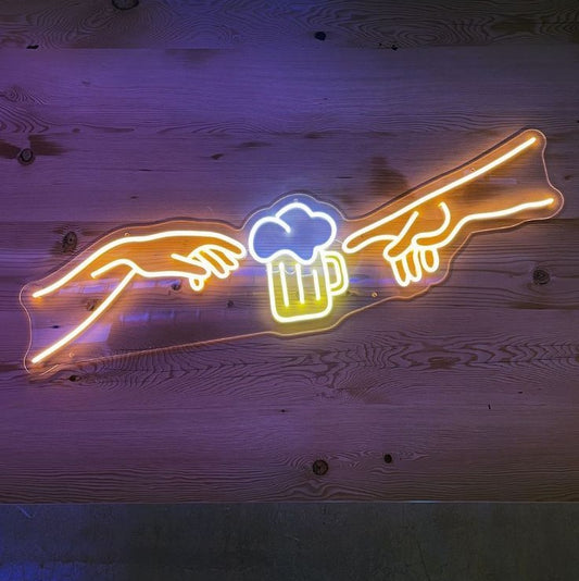 Beer Two Hand Neon Sign | Custom Neon Sign | Neon for Bar, Restaurant Neon sign of two hands reaching towards a beer mug on a wooden background