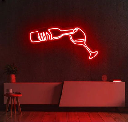 Bottle Wine Glass Neon Sign | Custom Neon Sign | Neon for Bar Decoration Sign  Neon sign of a bottle and glass on a dark wall with a red couch.