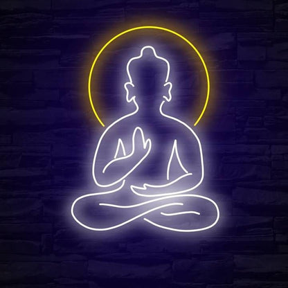 Buddha Meditation Neon Sign | Custom Neon Sign | Neon for Yoda Studio Neon sign of a meditating figure with a yellow halo on a dark brick wall background