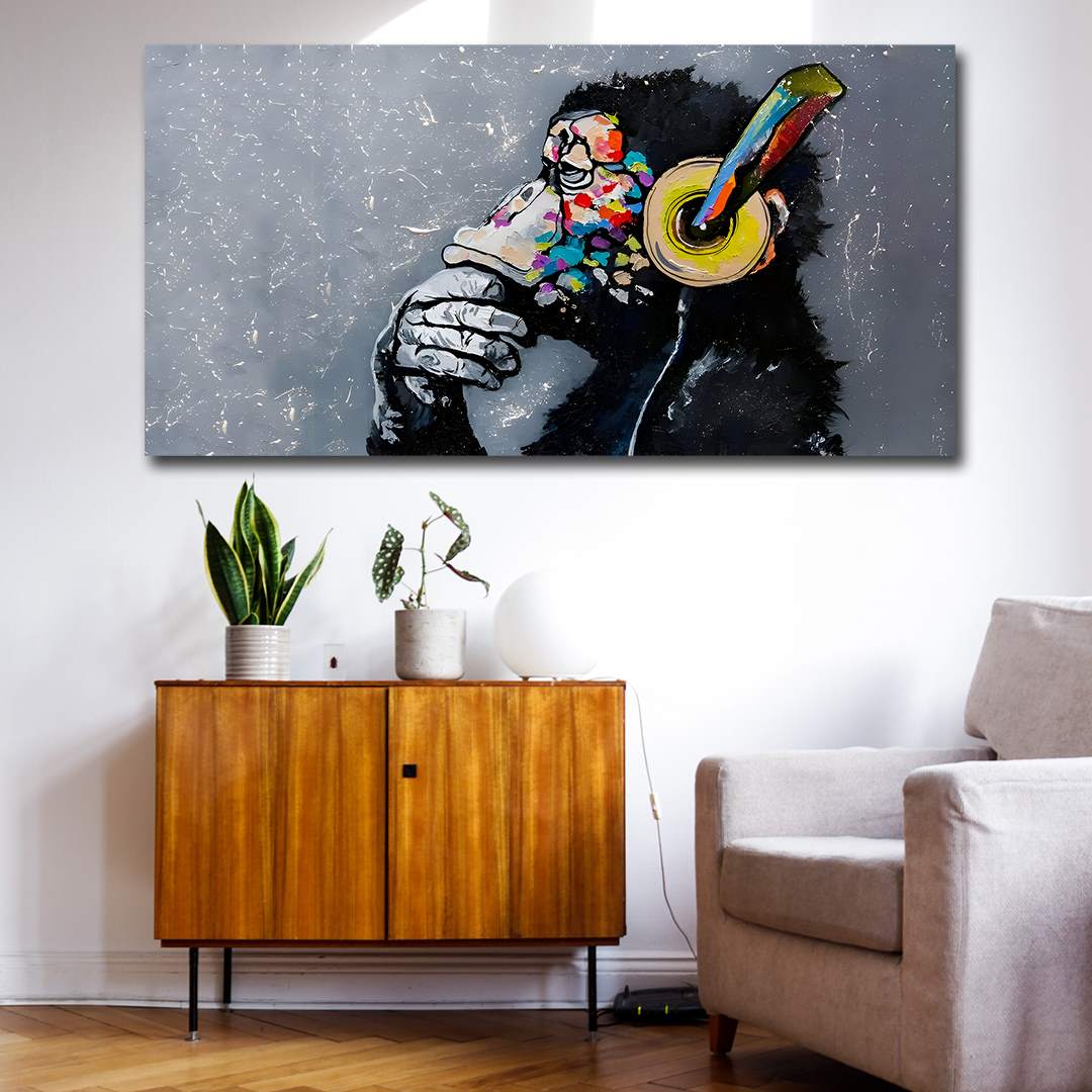 Canvas Painting Wall Frame | Modern Graffiti Chimpanzee with Headphones | Big Large Size Modern Art for Living Room (48x24 Inches) Colorful abstract painting of a person with headphones on a wall above a wooden cabinet and chair.