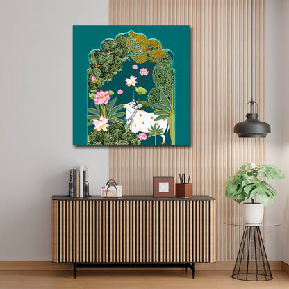 Canvas Painting Wall Frame | Traditional Indian Pichwai Cow Art | Sacred Kamdhenu with Pink Lotus in Teal Arch Modern Wall Art Decors (24x24 Inches) Decorative painting of a cow among flowers and foliage on a wall above a wooden cabinet.