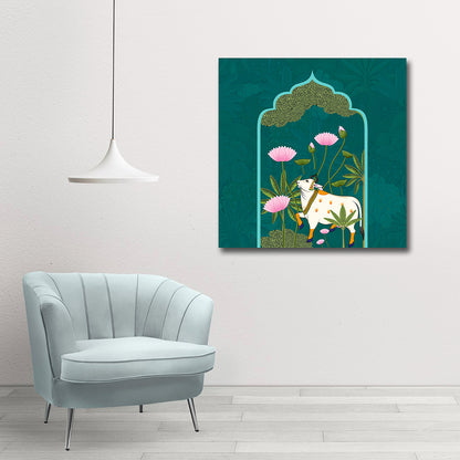Canvas Painting Wall Frame | Traditional Indian Pichwai Cow Art | Sacred Kamdhenu with Pink Lotus in Teal Arch Modern Wall Art Decors (24x24 Inches) Decorative painting of a cow and flowers on a teal background, hanging above a light blue chair.