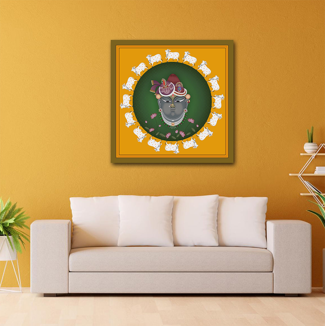 Canvas Pichwai Painting Wall Frame | Shrinathji Pichwai Art with Sacred Cows | Traditional Lord Krishna Portrait in Yellow and Green Modern Wall Art Decors (24x24 Inches) Framed artwork on a yellow wall above a beige sofa