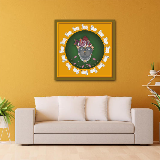 Canvas Pichwai Painting Wall Frame | Shrinathji Pichwai Art with Sacred Cows | Traditional Lord Krishna Portrait in Yellow and Green Modern Wall Art Decors (24x24 Inches) Framed artwork on a yellow wall above a beige sofa