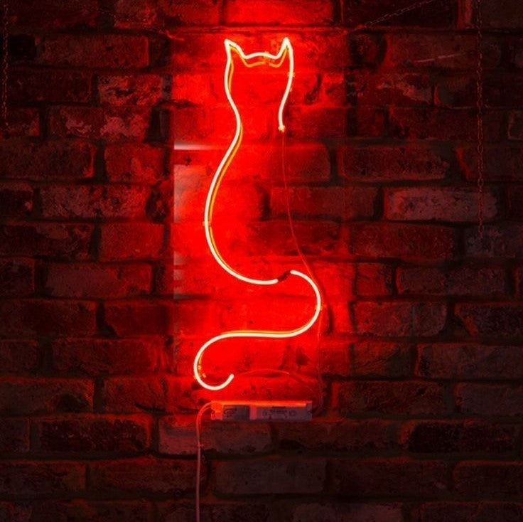Cat Line Art Neon Sign | Custom Neon Sign | Neon for Living Room Decor Red neon cat-shaped light on a brick wall