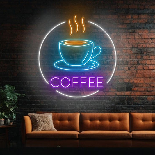 Coffee Cup Neon Sign | Custom Neon Sign | Neon for Restaurant, Shops Neon sign of a coffee cup with 'COFFEE' text on a brick wall above a brown sofa.