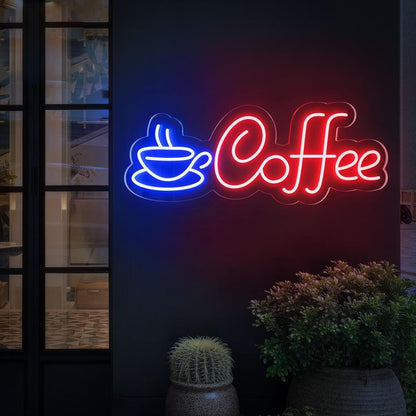 Neon sign with a coffee cup icon and 'Coffee' text on a dark background