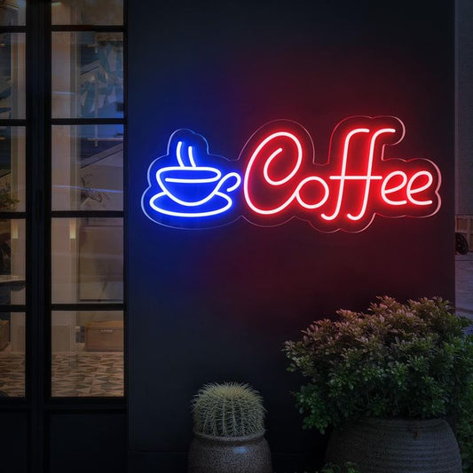 Neon sign with a coffee cup icon and 'Coffee' text on a dark background