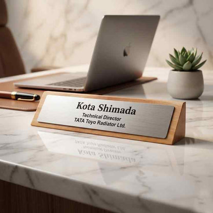 Personalised executive office name sign with a warm wood base and silver nameplate for a manager's desk, corporate office or reception counter.