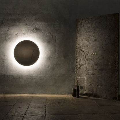 Decorative ambient wall lighting with round LED panels for modern home interiors.