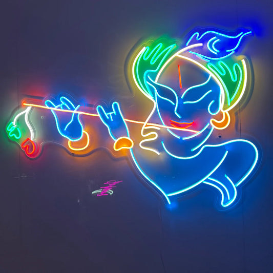 Flute Blowing Krishna Neon Sign | Custom Neon Sign | Neon for Wall Decor Neon light sculpture of a deity playing a flute on a dark background