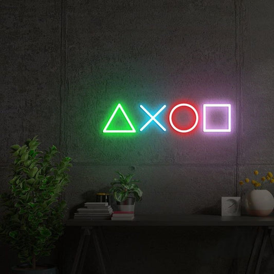 Game Button Neon Sign  – Custom Neon Sign for Game Room 24 By 15 Inches Neon sign with gaming symbols on a dark wall
