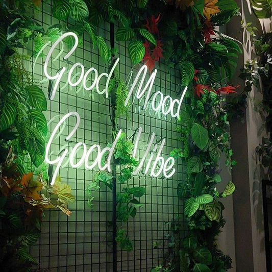 Good Mood Good Vibes Neon Sign | Custom Neon Sign | Neon for Living Room Decor Neon sign with 'Good Mood Good Vibe' surrounded by green foliage