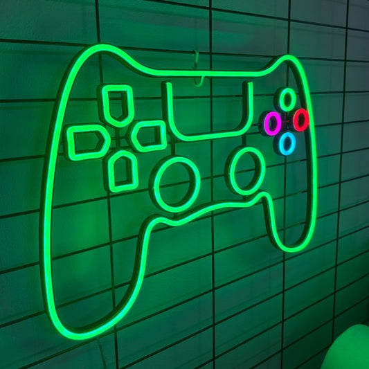 Green Game Remote Neon Sign – Custom Neon Sign for Game Room 20 By 20 Inches Neon green outline of a gaming controller on a tiled wall
