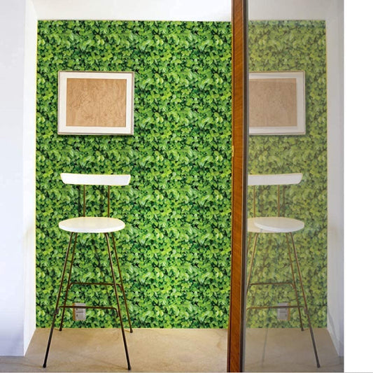 Green Leaves Design Wallpaper 17.71" X 118" Self-Adhesive Removable Peel and Stick Decorative Wall Covering (PVC, Size 45cm X 3Mtr Roll 9.84 Sqft, Green Color) Two bar stools in front of a green leafy wall with two framed pictures.