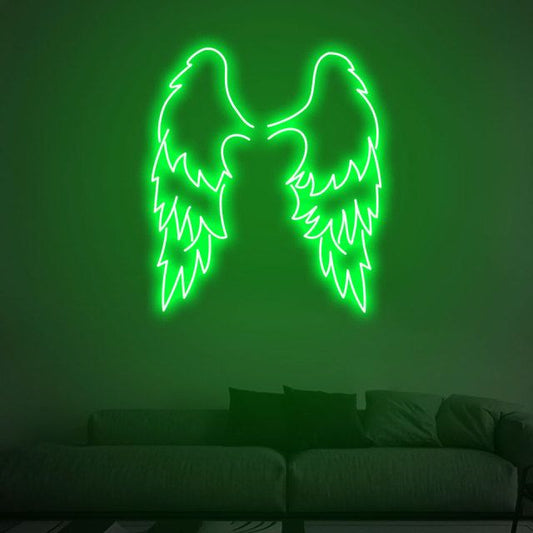 Green Wings Neon Sign | Custom Neon Sign | Neon for Living Room Neon green angel wings on a dark green wall above a sofa.