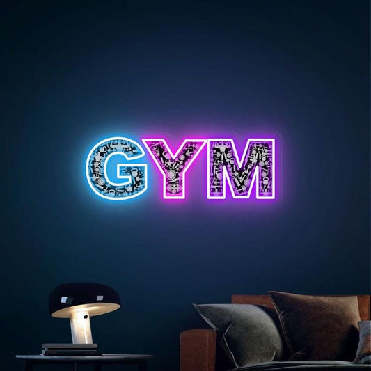 Gym UV Neon Sign | Custom Neon Sign | Neon for Gym Fitness Decor Neon sign with 'GYM' on a dark wall above a couch and lamp.