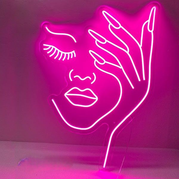Half Face Girl Neon Sign | Custom Neon Sign | Neon for Makeup Studio Neon sign of a face and hand on a pink background
