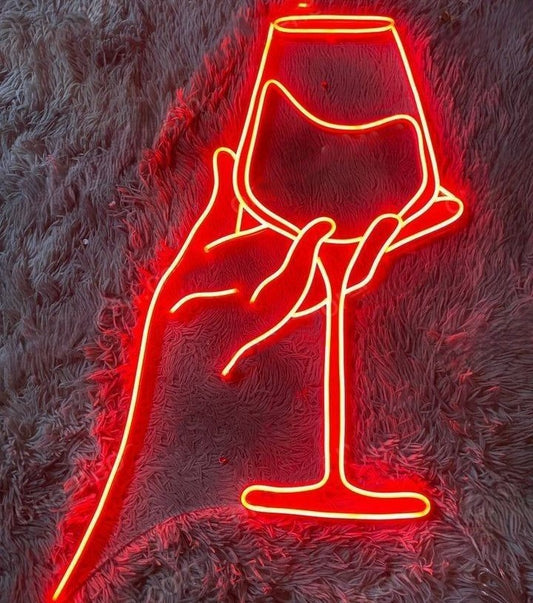 Hand Beer Glass Neon Sign | Custom Neon Sign | Neon for Restaurants, Bar Neon sign of a hand holding a wine glass on a textured surface