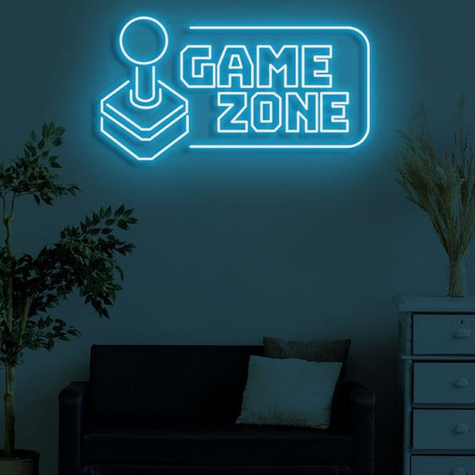 Handle Game Zone Neon Sign  – Custom Neon Sign for Game Room 20 By 15 Inches Neon sign with 'Game Zone' on a wall in a dark room with a couch and plants.