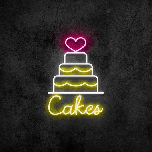 Heart Three Layer Cake Neon Sign – Custom Neon Sign for Living Room Neon sign of a cake with a heart on top against a dark background