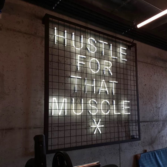 Motivational gym LED neon wall sign with Hustle For That Muscle quote for home gym and fitness club