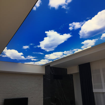 Backlit fabric ceiling panel featuring realistic clouds and blue sky for interior decoration