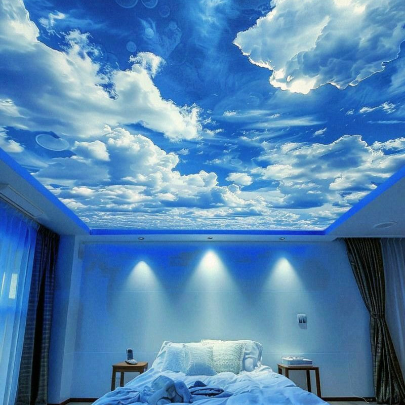 Backlit fabric ceiling panel featuring realistic clouds and blue sky in a modern interior