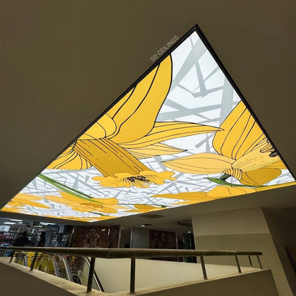 Backlit fabric ceiling panel with custom floral artwork installed above a modern retail space