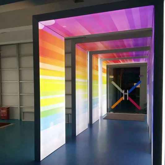 Custom backlit fabric light box panels with colourful graphics creating a vibrant interior display