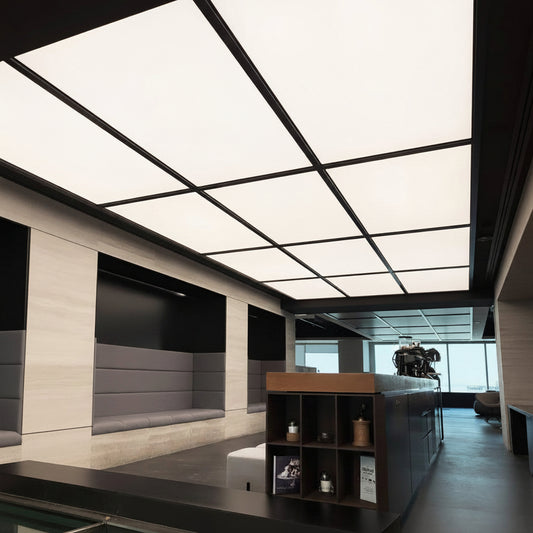 Large backlit fabric ceiling light panels providing continuous illumination in a contemporary commercial space