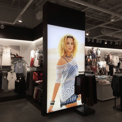 Vertical backlit fabric light box panel used as a fashion retail display