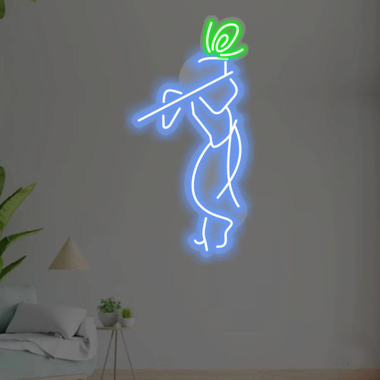 Lord Shri Krishna Neon Sign | Custom Neon Sign | Neon for Wall Decor Neon sculpture of a figure holding a flower on a white wall.