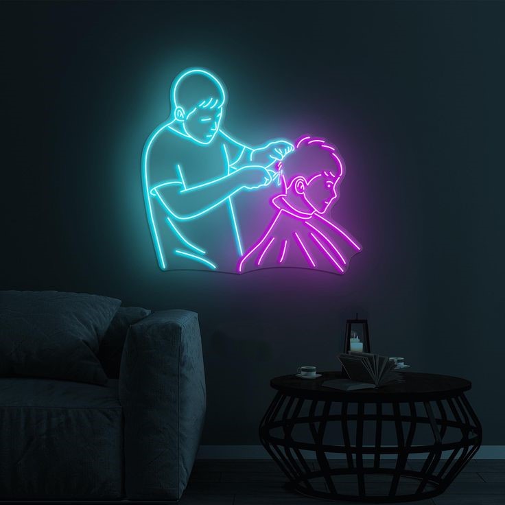 Men's Salon Neon Sign | Custom Neon Sign | Neon for Salon Neon sign of a person getting a haircut in a dark room with a couch and table.