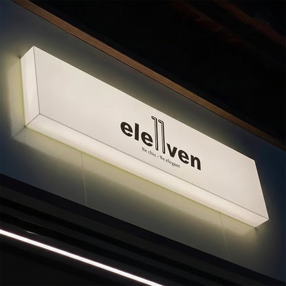 Modern personalized blade signage for outdoor shop office display with wall mounted business name.
