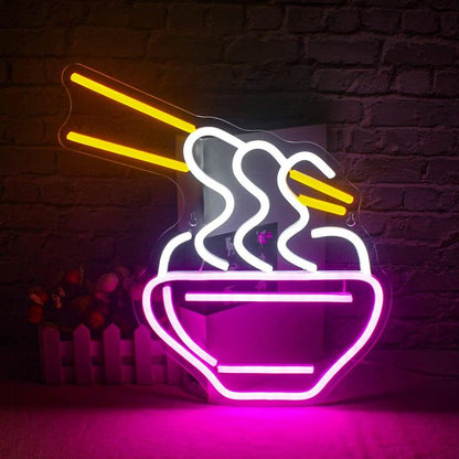 Noodles Stick Neon Sign | Custom Neon Sign | Neon for Cafe, Restaurants Neon sign of a bowl of noodles with chopsticks against a brick wall.