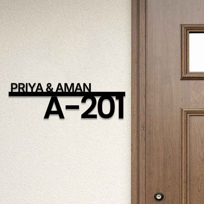 Custom black acrylic name plate featuring family name and flat number for office and home