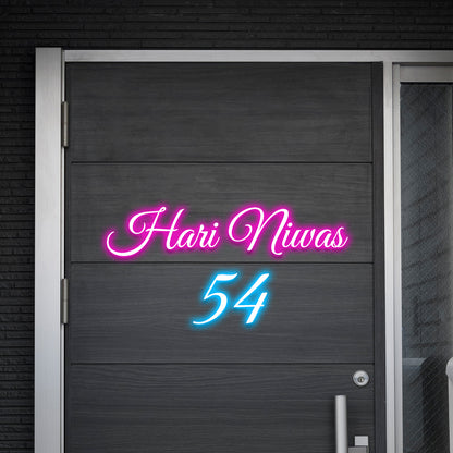 Custom glowing neon house name sign with pink lettering and blue number for entrance decor