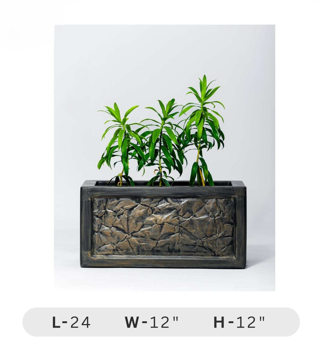Planters Pots for Decors, Giftings | FRP Pots and Planets for Office Decors Rectangular planter with textured design containing green plants on a white background