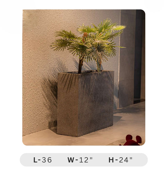 Planters Pots for Decors, Giftings | FRP Pots and Planets for Office Decors Square concrete planter with a plant against a textured wall.