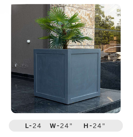 Planters Pots for Decors, Giftings | FRP Pots and Planets for Office Decors Gray rectangular planter with a palm plant on a stone surface, dimensions displayed.
