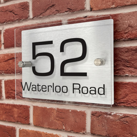 Custom stainless steel address sign with acrylic panel and stand-off wall mounting hardware