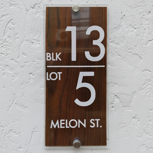 Personalized wood grain address plaque with acrylic front panel and stainless steel mounting hardware