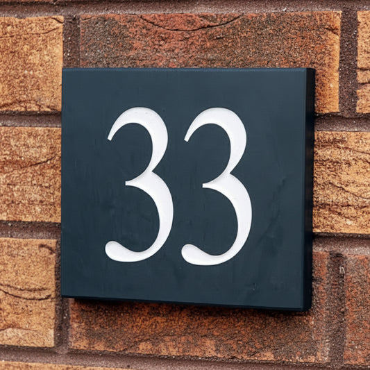 Modern minimalist outdoor address plaque featuring personalized house number in weather-resistant finish