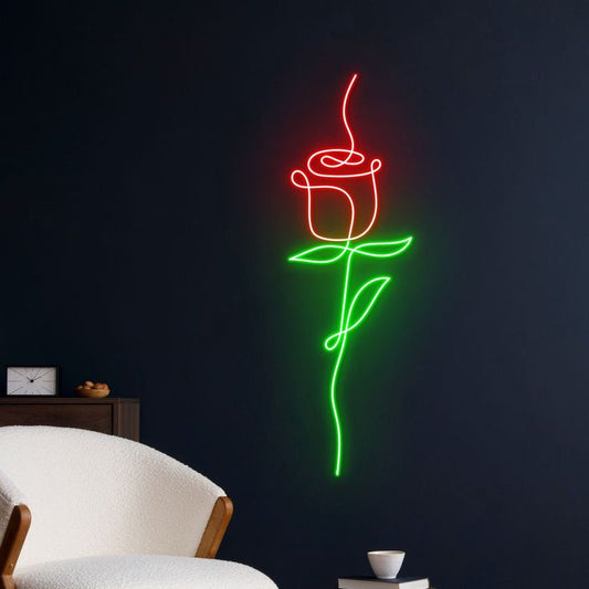 Red Rose Flower Neon Sign – Custom Neon Sign Gift for Women Neon rose light on a dark wall with a white chair in the foreground